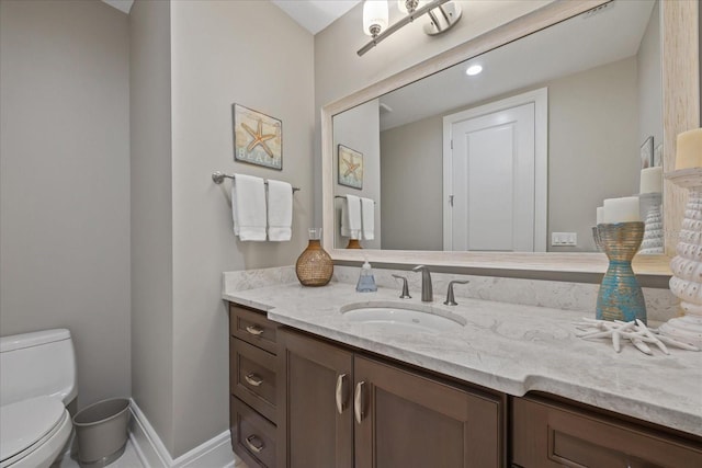 2 Gulf Blvd, Indian Rocks Beach, FL 33785 - bathroom featuring vanity, toilet, and baseboards