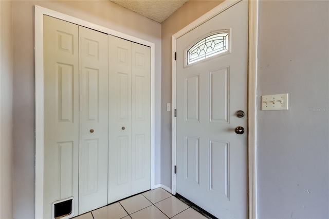 2932 Lichen Ln Unit D, Clearwater, FL 33760 - entrance foyer with light tile patterned floors and baseboards