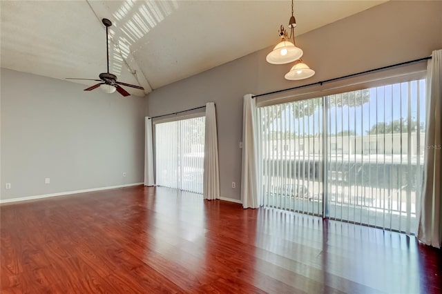 2932 Lichen Ln Unit D, Clearwater, FL 33760 - unfurnished room featuring ceiling fan, wood finished floors, baseboards, and high vaulted ceiling