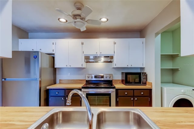 2932 Lichen Ln Unit D, Clearwater, FL 33760 - kitchen with stainless steel appliances, under cabinet range hood, washer / clothes dryer, butcher block counters, and recessed lighting