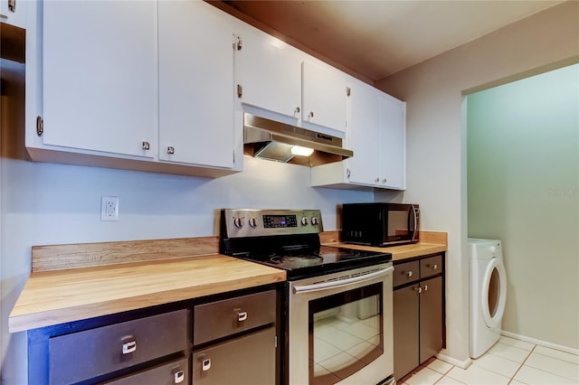 2932 Lichen Ln Unit D, Clearwater, FL 33760 - kitchen featuring stainless steel electric stove, under cabinet range hood, black microwave, washer / dryer, and light tile patterned floors
