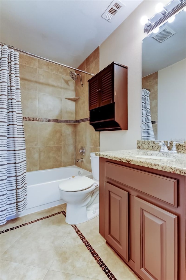 2932 Lichen Ln Unit D, Clearwater, FL 33760 - bathroom featuring vanity, shower / bath combo with shower curtain, tile patterned floors, and toilet
