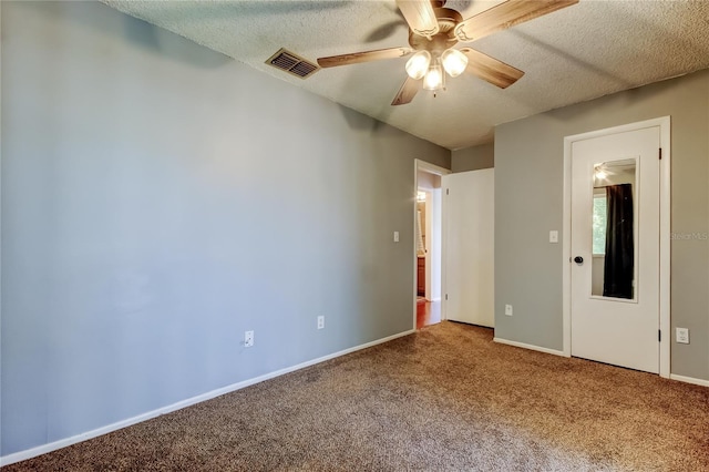 2932 Lichen Ln Unit D, Clearwater, FL 33760 - unfurnished bedroom featuring carpet flooring, a textured ceiling, baseboards, and a ceiling fan