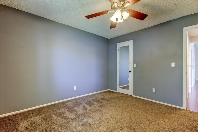 2932 Lichen Ln Unit D, Clearwater, FL 33760 - carpeted empty room featuring baseboards, a ceiling fan, and a textured ceiling