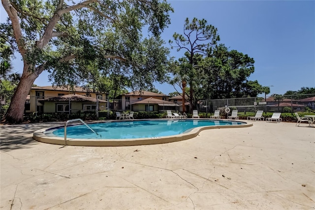 2932 Lichen Ln Unit D, Clearwater, FL 33760 - community pool featuring a patio area