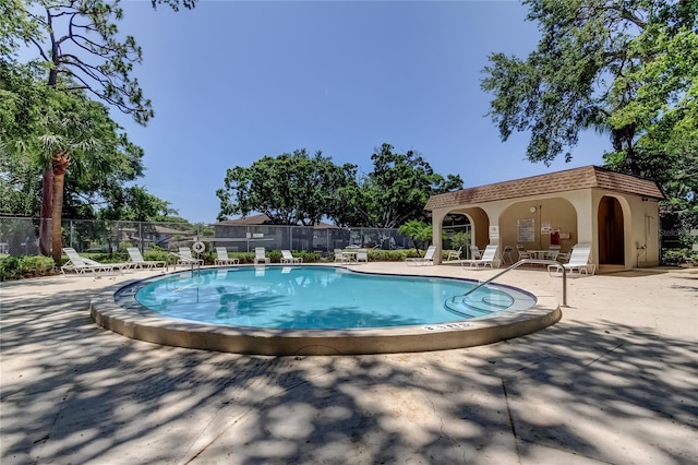 2932 Lichen Ln Unit D, Clearwater, FL 33760 - community pool featuring a patio