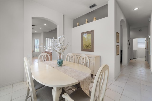 1130 Hominy Hill Dr, Trinity, FL 34655 - dining space with arched walkways, light tile patterned flooring, recessed lighting, and baseboards