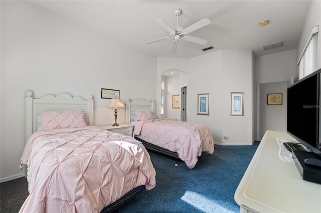 1130 Hominy Hill Dr, Trinity, FL 34655 - bedroom featuring carpet floors, arched walkways, a ceiling fan, and baseboards