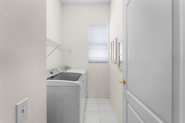1130 Hominy Hill Dr, Trinity, FL 34655 - laundry area with independent washer and dryer, light tile patterned flooring, and baseboards