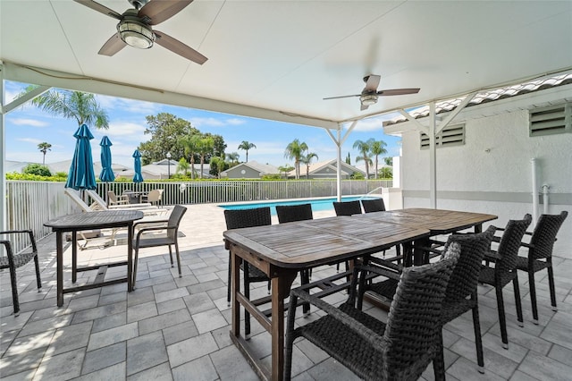 1130 Hominy Hill Dr, Trinity, FL 34655 - fenced backyard featuring outdoor dining area, a ceiling fan, and a patio