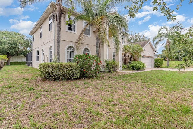239 Beacon Pointe Dr, Ocoee, FL 34761 - view of front facade featuring a garage, a front yard, driveway, and stucco siding