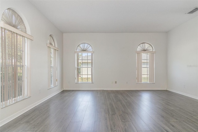 239 Beacon Pointe Dr, Ocoee, FL 34761 - unfurnished room featuring dark wood-style flooring and baseboards