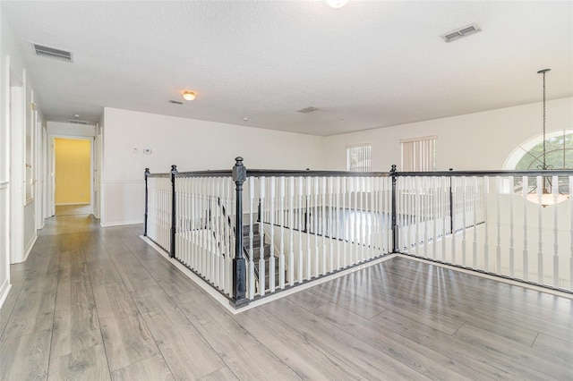 239 Beacon Pointe Dr, Ocoee, FL 34761 - corridor with wood finished floors and baseboards