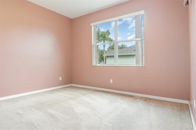 239 Beacon Pointe Dr, Ocoee, FL 34761 - unfurnished room with baseboards and light colored carpet