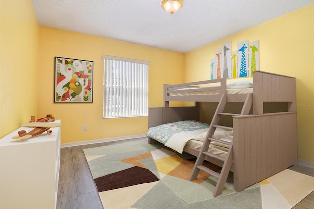 239 Beacon Pointe Dr, Ocoee, FL 34761 - bedroom featuring wood finished floors and baseboards