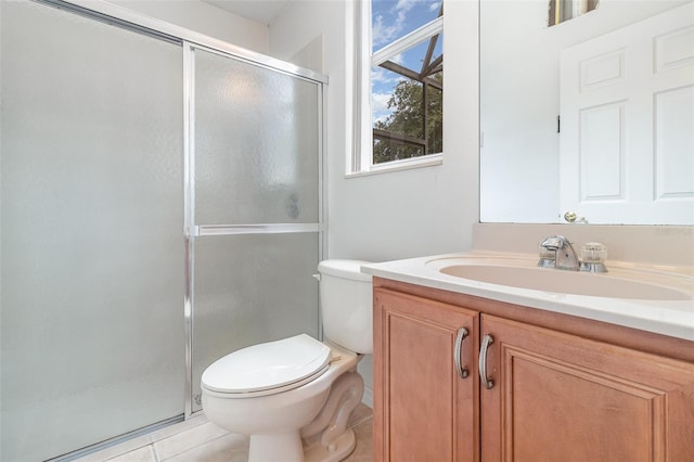 239 Beacon Pointe Dr, Ocoee, FL 34761 - bathroom with toilet, vanity, a shower stall, and tile patterned flooring