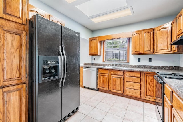 7347 Pulsar St, New Port Richey, FL 34652 - kitchen featuring black appliances, a sink, brown cabinetry, light tile patterned floors, and under cabinet range hood
