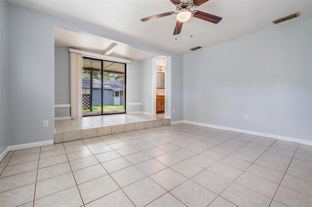 7347 Pulsar St, New Port Richey, FL 34652 - empty room with light tile patterned flooring, baseboards, and a ceiling fan
