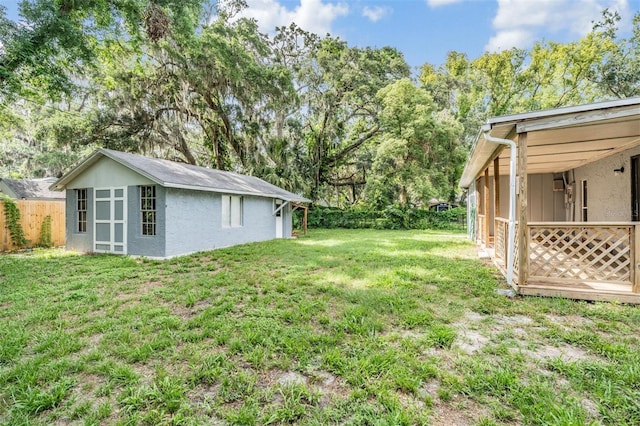 7347 Pulsar St, New Port Richey, FL 34652 - view of yard with an outdoor structure and view of wooded area