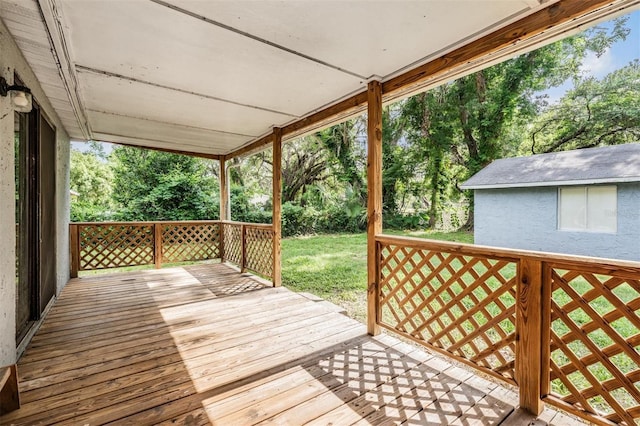 7347 Pulsar St, New Port Richey, FL 34652 - wooden deck with view of scattered trees and a lawn