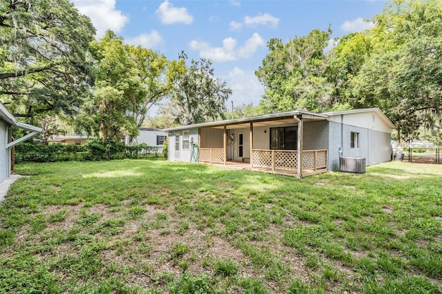 7347 Pulsar St, New Port Richey, FL 34652 - back of property featuring stucco siding and central air condition unit