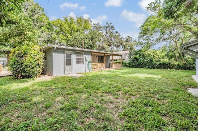 7347 Pulsar St, New Port Richey, FL 34652 - view of front facade with stucco siding and a front yard