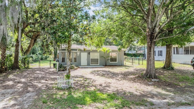 7347 Pulsar St, New Port Richey, FL 34652 - view of front facade with a gate and stucco siding