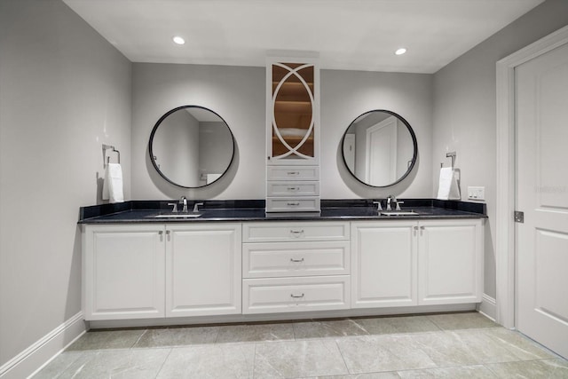12 Country Club Ln, Belleair, FL 33756 - bathroom featuring double vanity, baseboards, and recessed lighting