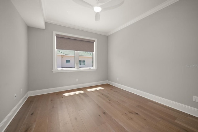 12 Country Club Ln, Belleair, FL 33756 - empty room featuring wood finished floors, ornamental molding, a ceiling fan, and baseboards