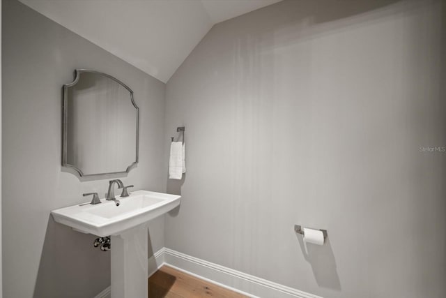12 Country Club Ln, Belleair, FL 33756 - bathroom featuring wood finished floors, baseboards, and lofted ceiling