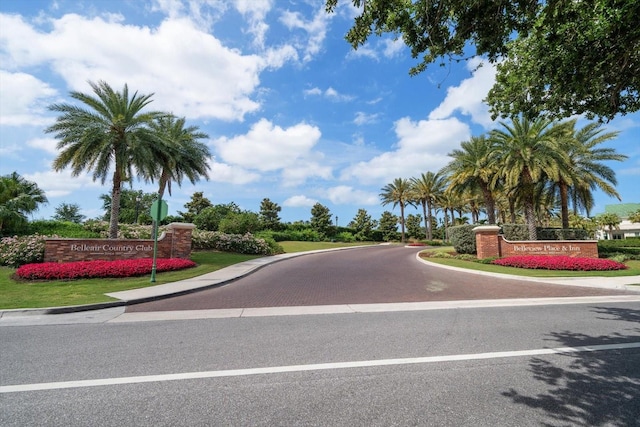 12 Country Club Ln, Belleair, FL 33756 - view of asphalt road featuring curbs and traffic signs