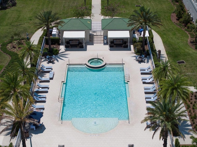 12 Country Club Ln, Belleair, FL 33756 - community pool with a gazebo, a hot tub, a patio, and an outdoor hangout area