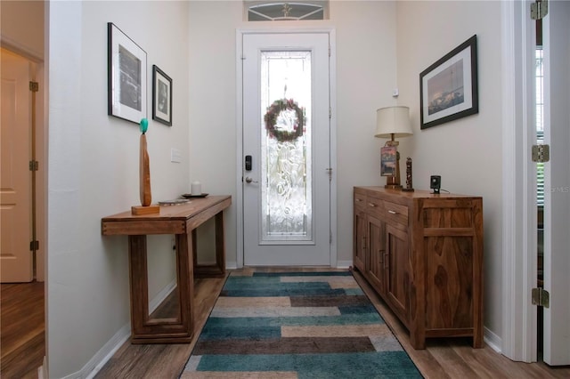 2121 Worthington Greens Dr, Sun City Center, FL 33573 - entrance foyer featuring wood finished floors and baseboards