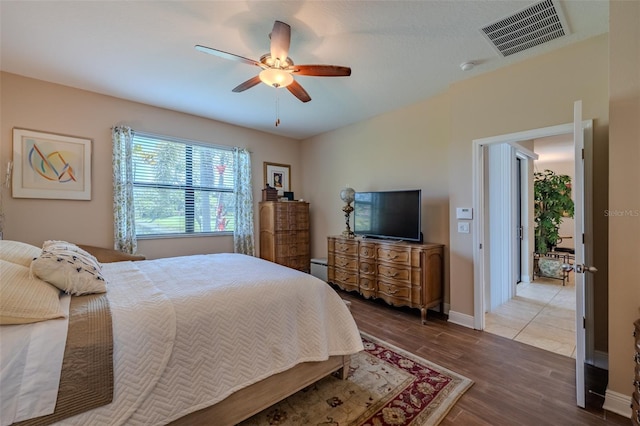 347 Cockle Shell Loop, Apollo Beach, FL 33572 - bedroom featuring ceiling fan, baseboards, and wood finished floors