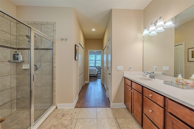 347 Cockle Shell Loop, Apollo Beach, FL 33572 - bathroom with ensuite bathroom, vanity, a shower stall, baseboards, and recessed lighting