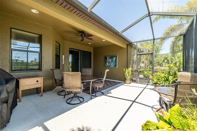 347 Cockle Shell Loop, Apollo Beach, FL 33572 - view of patio / terrace with outdoor dining space, ceiling fan, and glass enclosure