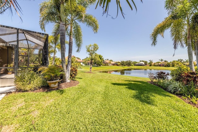 347 Cockle Shell Loop, Apollo Beach, FL 33572 - view of green lawn with a water view and glass enclosure