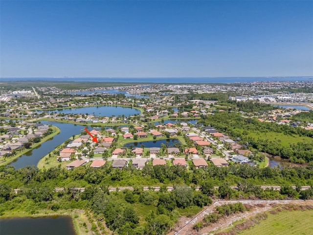 347 Cockle Shell Loop, Apollo Beach, FL 33572 - aerial overview of property's location with nearby suburban area and a large body of water