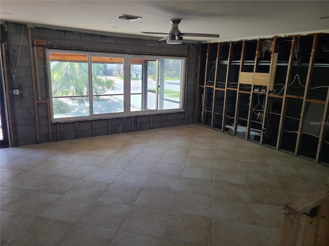 860 Bruce Ave, Clearwater Beach, FL 33767 - empty room with a ceiling fan and tile patterned floors