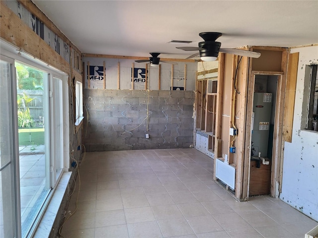 860 Bruce Ave, Clearwater Beach, FL 33767 - unfurnished room with water heater, ceiling fan, and light tile patterned floors