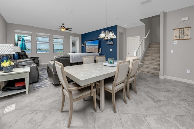11320 Chilly Water Ct, Riverview, FL 33569 - dining area with stairs, a chandelier, baseboards, light tile patterned floors, and ceiling fan