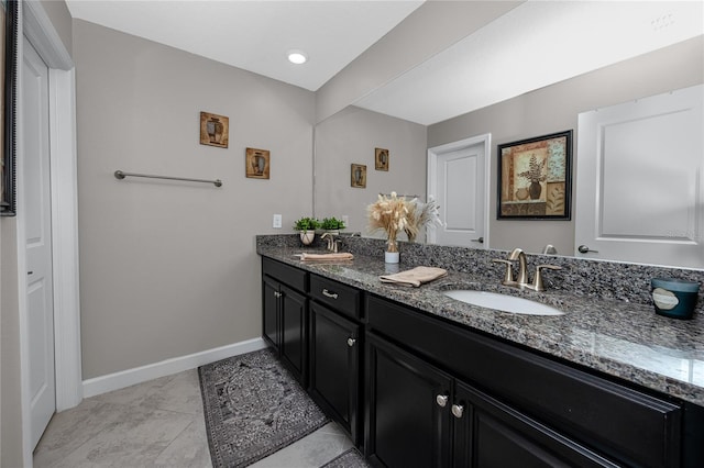 11320 Chilly Water Ct, Riverview, FL 33569 - bathroom featuring double vanity and baseboards