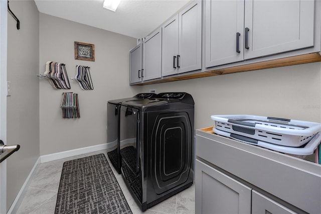 11320 Chilly Water Ct, Riverview, FL 33569 - laundry area with cabinet space, washer and dryer, baseboards, and light marble finish flooring