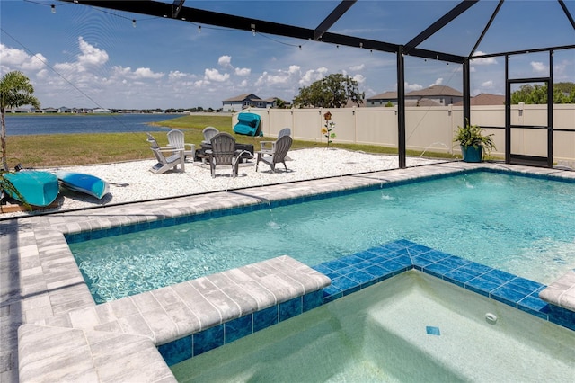 11320 Chilly Water Ct, Riverview, FL 33569 - view of pool with a patio, glass enclosure, a water view, and a pool with connected hot tub