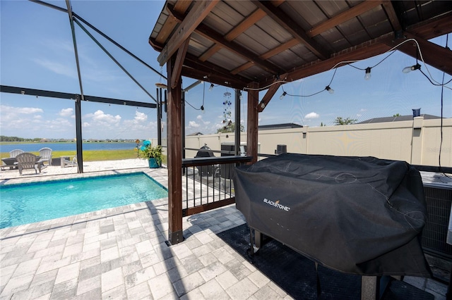 11320 Chilly Water Ct, Riverview, FL 33569 - view of patio / terrace featuring a grill, an outdoor pool, and a water view