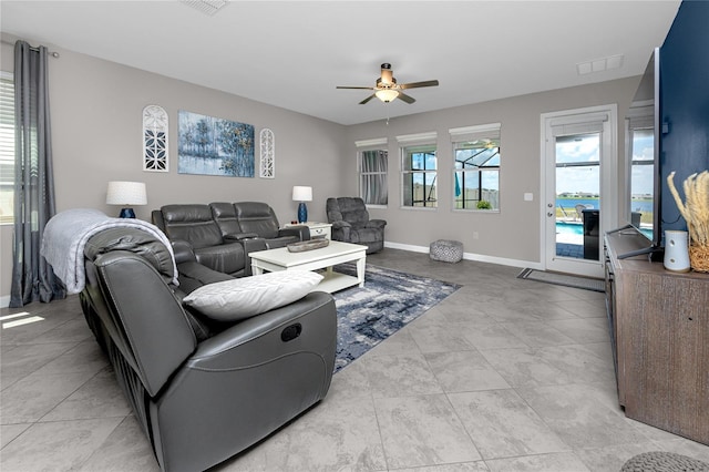 11320 Chilly Water Ct, Riverview, FL 33569 - tiled living room featuring ceiling fan and baseboards