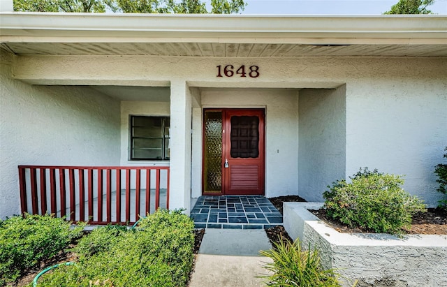 1648 Concord St, Dunedin, FL 34698 - property entrance with stucco siding