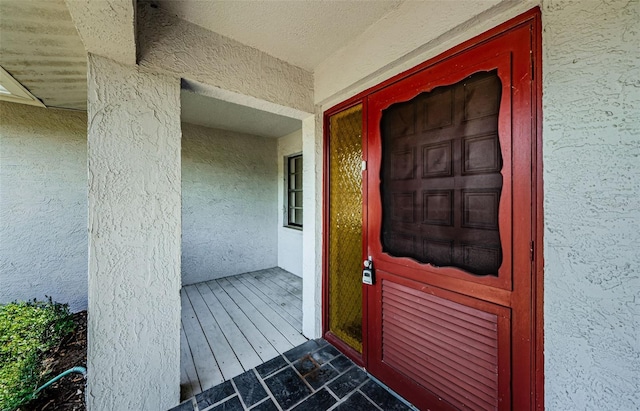 1648 Concord St, Dunedin, FL 34698 - doorway to property featuring stucco siding