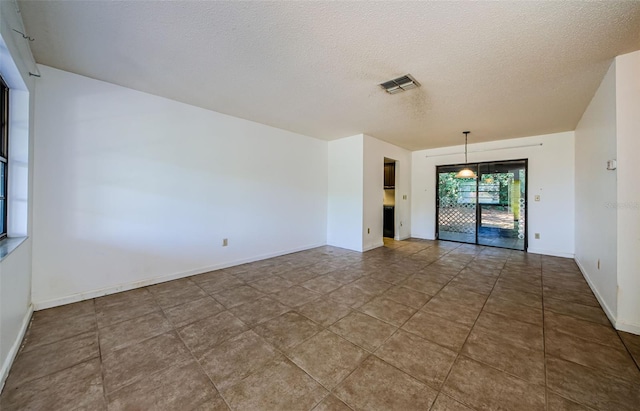 1648 Concord St, Dunedin, FL 34698 - unfurnished room featuring a textured ceiling and baseboards