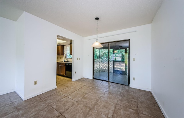 1648 Concord St, Dunedin, FL 34698 - spare room with a sink, baseboards, and light tile patterned floors